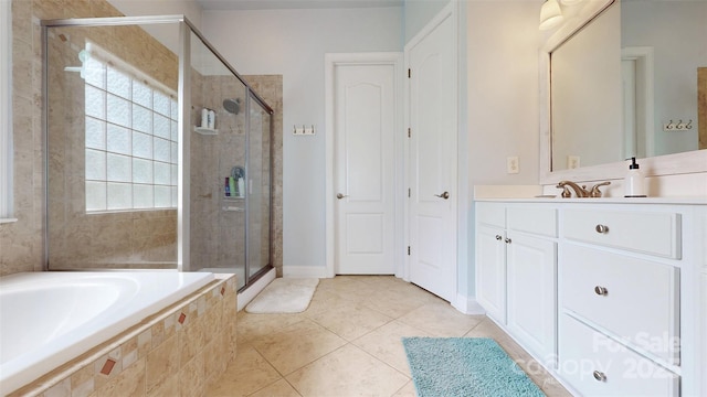 8605 Soaring Eagle Ln, Waxhaw, NC 28173 - bathroom with a shower stall, a garden tub, tile patterned floors, vanity, and baseboards