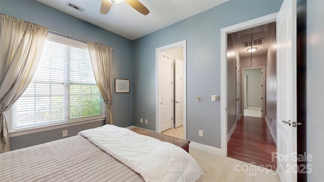 8605 Soaring Eagle Ln, Waxhaw, NC 28173 - carpeted bedroom featuring attic access, multiple windows, baseboards, and a ceiling fan