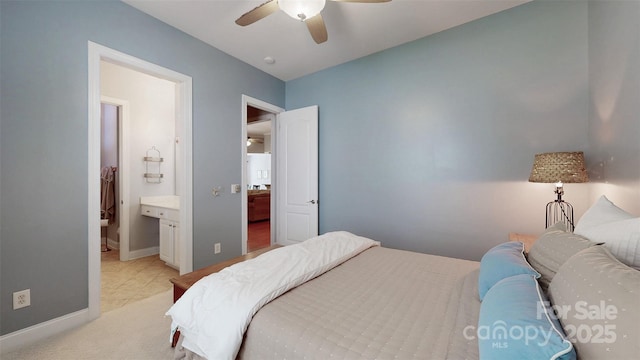 8605 Soaring Eagle Ln, Waxhaw, NC 28173 - bedroom with baseboards, ensuite bathroom, a ceiling fan, and light carpet