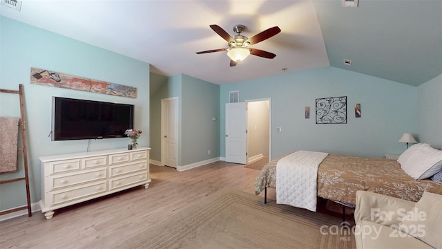 8605 Soaring Eagle Ln, Waxhaw, NC 28173 - bedroom featuring wood finished floors, lofted ceiling, baseboards, and a ceiling fan