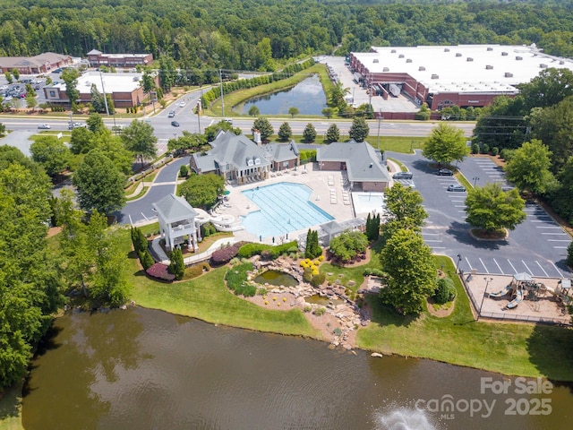 8605 Soaring Eagle Ln, Waxhaw, NC 28173 - drone / aerial view of a heavily wooded area, a pool, and a nearby body of water