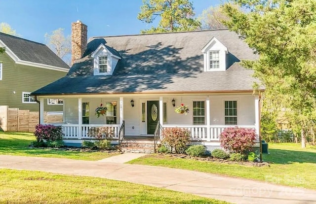 3921 Bon Rea Dr, Charlotte, NC 28226 - cape cod house with a porch and a chimney