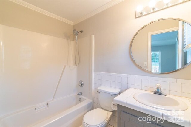 3921 Bon Rea Dr, Charlotte, NC 28226 - bathroom with vanity, toilet, washtub / shower combination, ornamental molding, and wainscoting