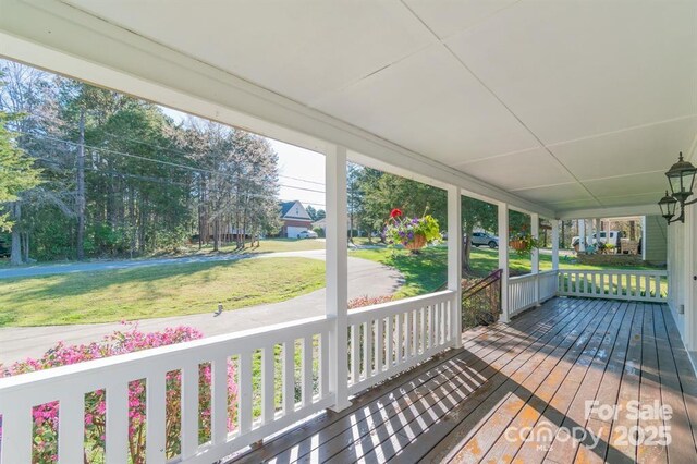 3921 Bon Rea Dr, Charlotte, NC 28226 - wooden porch with a lawn