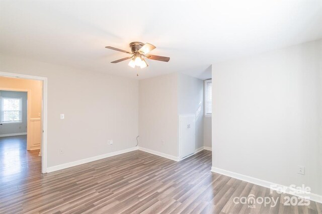 3921 Bon Rea Dr, Charlotte, NC 28226 - spare room with wood finished floors, ceiling fan, and baseboards