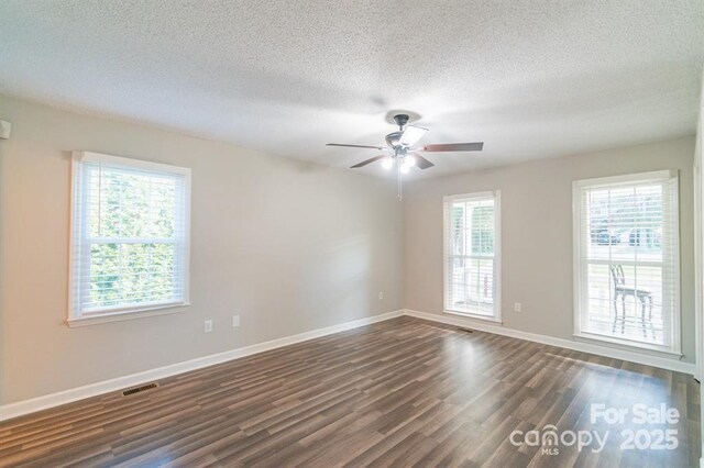 3921 Bon Rea Dr, Charlotte, NC 28226 - spare room featuring dark wood-style flooring, ceiling fan, baseboards, and a textured ceiling