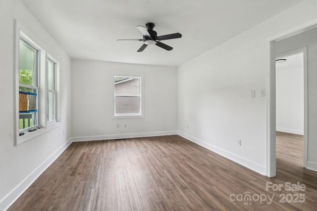 330 Willow Oak Cir, Lancaster, SC 29720 - empty room with dark wood-style flooring, plenty of natural light, a ceiling fan, and baseboards