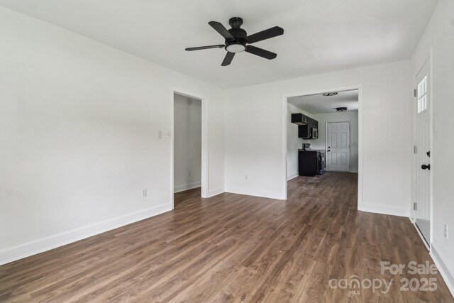 330 Willow Oak Cir, Lancaster, SC 29720 - unfurnished living room featuring dark wood finished floors, ceiling fan, and baseboards