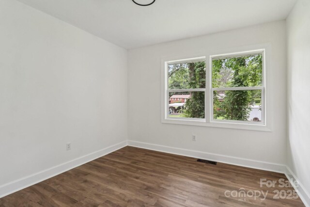330 Willow Oak Cir, Lancaster, SC 29720 - unfurnished room with baseboards and dark wood-style flooring