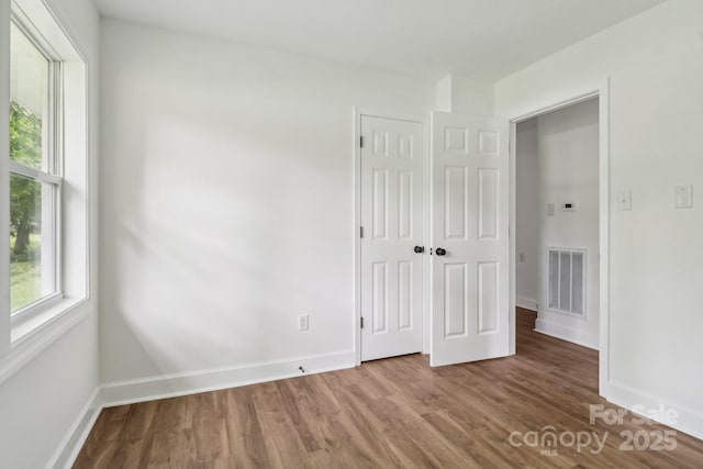 330 Willow Oak Cir, Lancaster, SC 29720 - unfurnished bedroom featuring wood finished floors, baseboards, and a closet