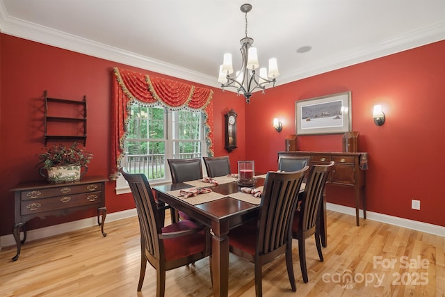 270 N St, Salisbury, NC 28147 - dining space featuring a chandelier, light wood-style floors, crown molding, and baseboards