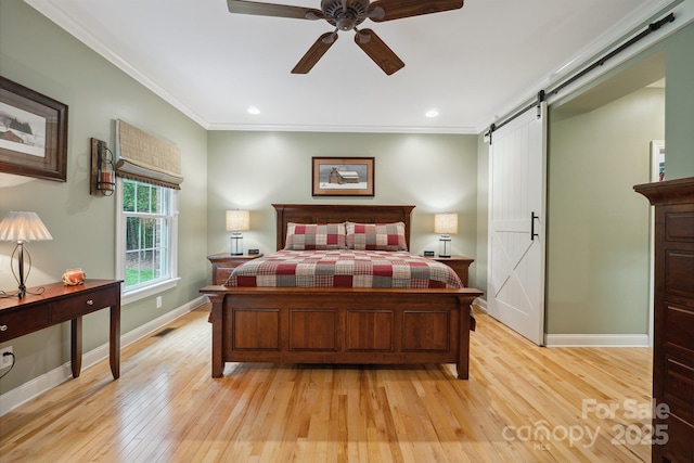 270 N St, Salisbury, NC 28147 - bedroom featuring a barn door, baseboards, light wood-type flooring, crown molding, and recessed lighting
