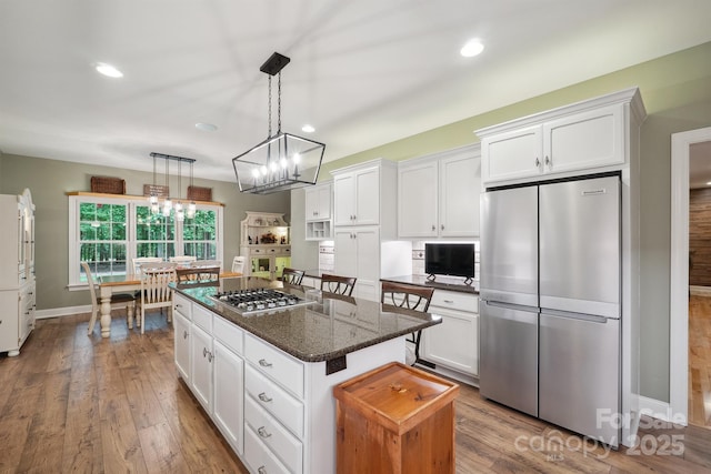 270 N St, Salisbury, NC 28147 - kitchen featuring stainless steel appliances, a kitchen island, white cabinetry, dark wood-type flooring, and recessed lighting
