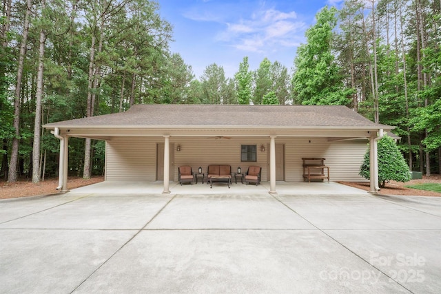 270 N St, Salisbury, NC 28147 - view of front facade with concrete driveway, an attached carport, ceiling fan, and an outdoor hangout area