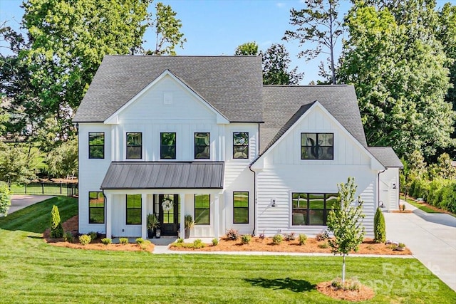 1149 Rosecliff Dr, Waxhaw, NC 28173 - view of front of property with board and batten siding, concrete driveway, a shingled roof, a standing seam roof, and metal roof