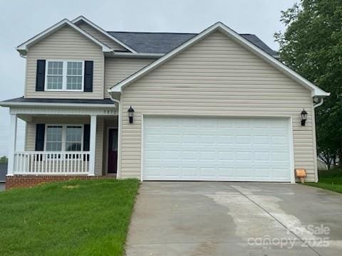 1872 Terrain Dr NW, Conover, NC 28613 - view of front of property with concrete driveway, a porch, an attached garage, and a front lawn