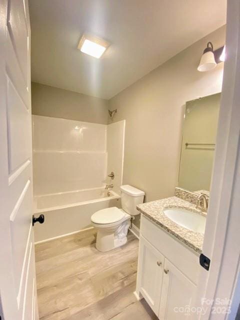 1872 Terrain Dr NW, Conover, NC 28613 - full bathroom featuring wood finished floors, vanity, toilet, and shower / bathtub combination