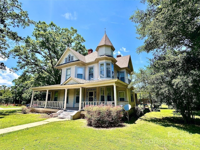 4689 Lakeview Acres Rd, Valdese, NC 28690 - victorian home featuring a porch, a front lawn, and a chimney