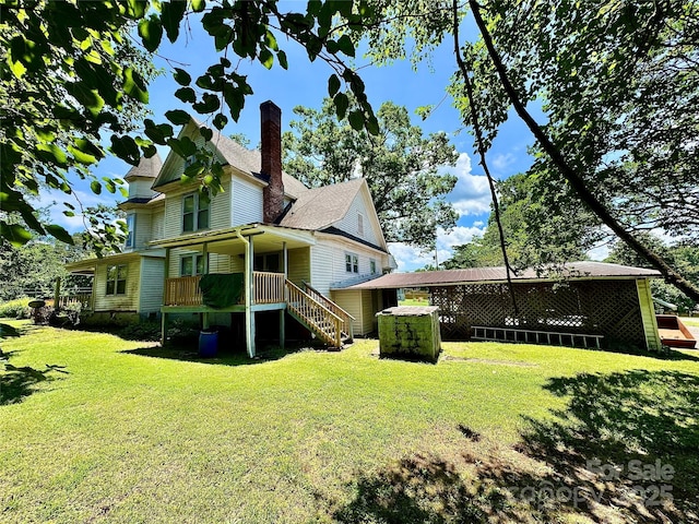 4689 Lakeview Acres Rd, Valdese, NC 28690 - rear view of property featuring a lawn, a chimney, and stairs