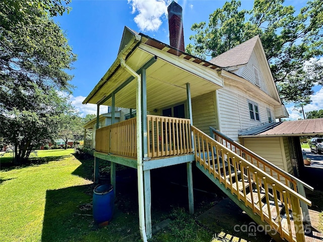 4689 Lakeview Acres Rd, Valdese, NC 28690 - view of property exterior featuring a yard, stairs, a wooden deck, and a chimney