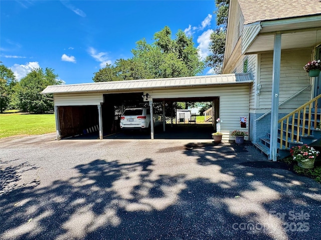 4689 Lakeview Acres Rd, Valdese, NC 28690 - garage featuring asphalt driveway and a carport