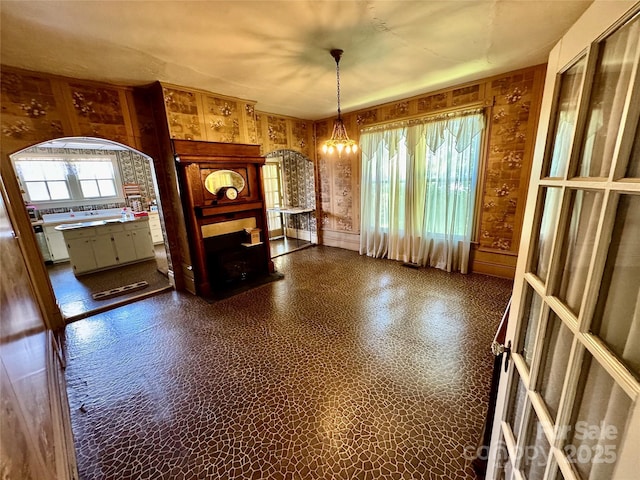4689 Lakeview Acres Rd, Valdese, NC 28690 - unfurnished living room featuring a chandelier, a fireplace, and dark flooring