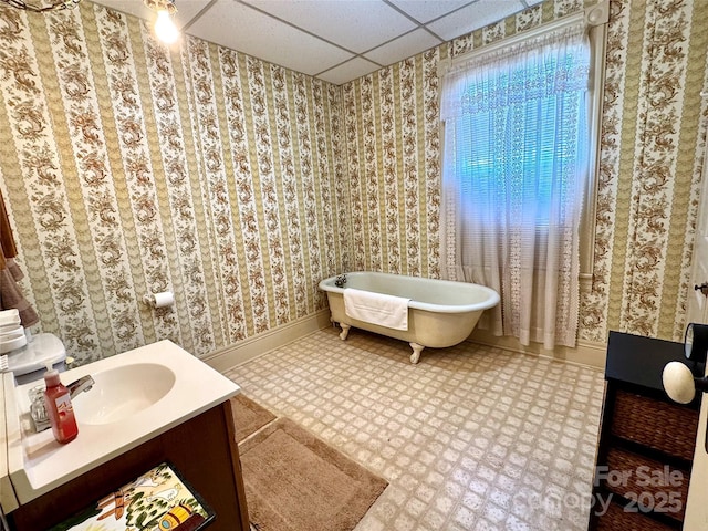 4689 Lakeview Acres Rd, Valdese, NC 28690 - full bathroom featuring vanity, a freestanding tub, a drop ceiling, and wallpapered walls