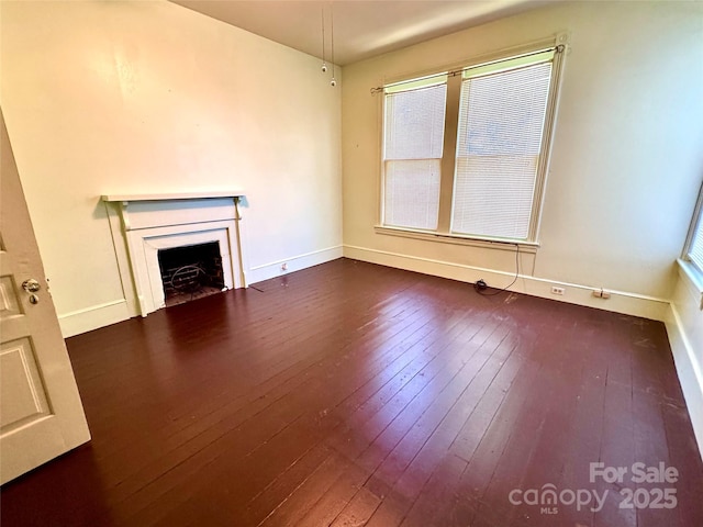 4689 Lakeview Acres Rd, Valdese, NC 28690 - unfurnished living room featuring dark wood-style flooring and a fireplace with flush hearth