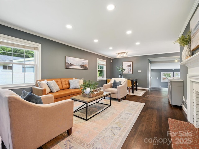 827 Fairbanks Rd, Charlotte, NC 28210 - living room with crown molding, recessed lighting, baseboards, dark wood-style flooring, and a brick fireplace