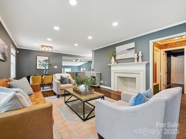 827 Fairbanks Rd, Charlotte, NC 28210 - living area featuring ornamental molding, recessed lighting, wood finished floors, a fireplace, and baseboards