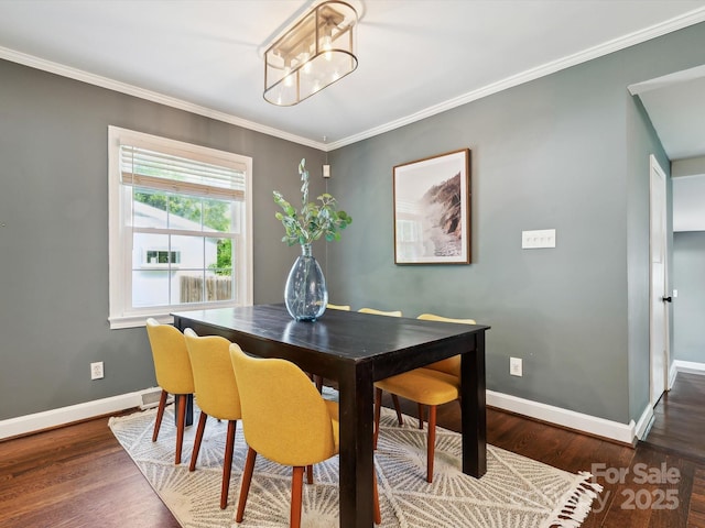 827 Fairbanks Rd, Charlotte, NC 28210 - dining room featuring wood finished floors, baseboards, crown molding, and a chandelier