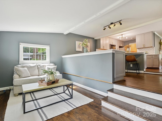 827 Fairbanks Rd, Charlotte, NC 28210 - living room with wood finished floors, lofted ceiling, and baseboards