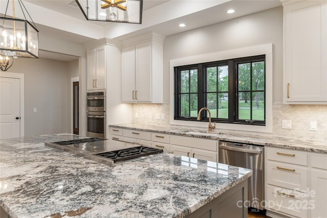 467 Dale Rd, Spruce Pine, NC 28777 - kitchen featuring appliances with stainless steel finishes, a sink, recessed lighting, a chandelier, and light stone counters
