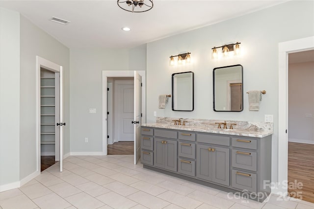 467 Dale Rd, Spruce Pine, NC 28777 - full bathroom featuring double vanity, baseboards, recessed lighting, and a walk in closet