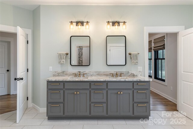 467 Dale Rd, Spruce Pine, NC 28777 - bathroom with double vanity, baseboards, and tile patterned flooring
