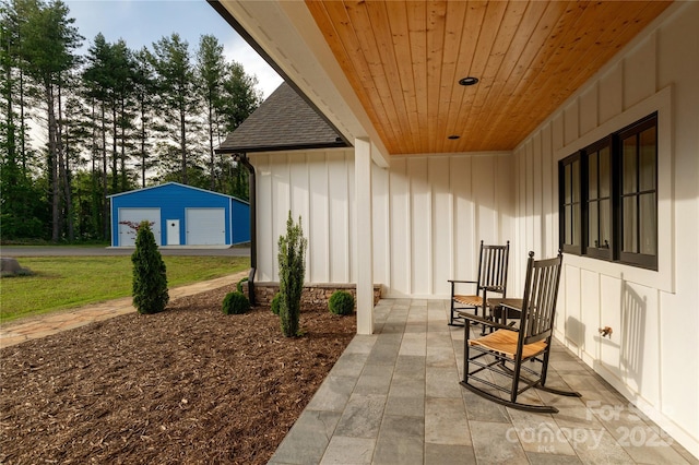 467 Dale Rd, Spruce Pine, NC 28777 - view of patio with a garage and an outbuilding