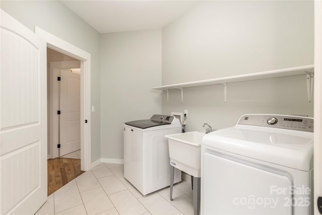 467 Dale Rd, Spruce Pine, NC 28777 - washroom with washer and dryer, light tile patterned floors, and baseboards
