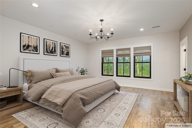 467 Dale Rd, Spruce Pine, NC 28777 - bedroom featuring a chandelier, light wood-style flooring, recessed lighting, and baseboards