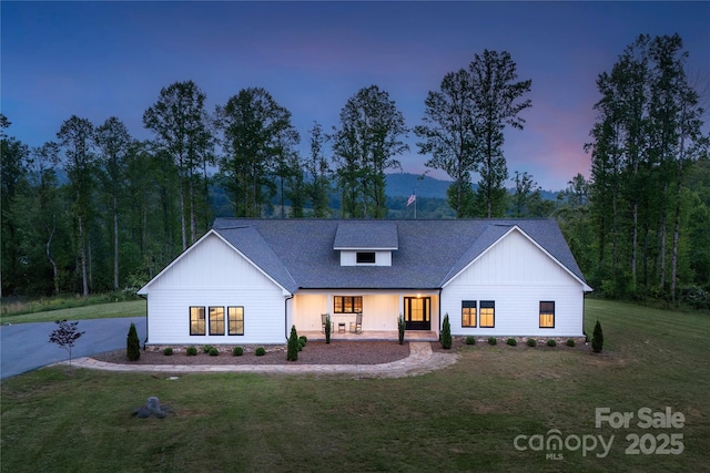 467 Dale Rd, Spruce Pine, NC 28777 - modern inspired farmhouse with covered porch, a lawn, and a shingled roof