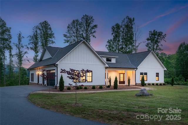 467 Dale Rd, Spruce Pine, NC 28777 - modern farmhouse style home with driveway, a yard, board and batten siding, and an attached garage