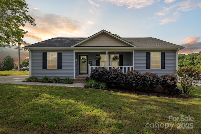 835 Jet St, Kannapolis, NC 28081 - ranch-style house with covered porch, a yard, and a shingled roof