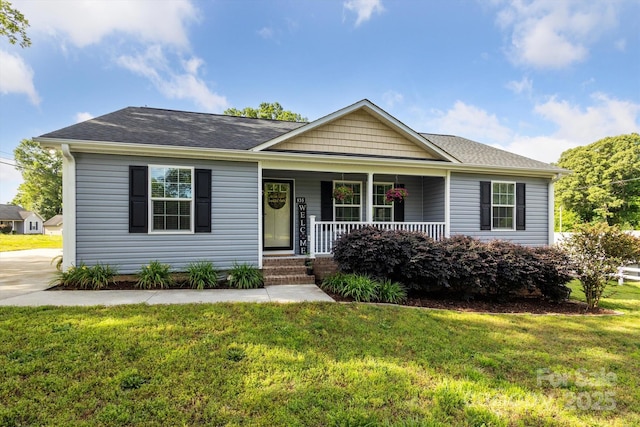 835 Jet St, Kannapolis, NC 28081 - ranch-style house featuring covered porch, a front lawn, and a shingled roof
