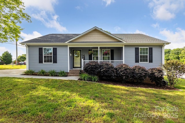 835 Jet St, Kannapolis, NC 28081 - ranch-style house featuring a porch, a front yard, and roof with shingles