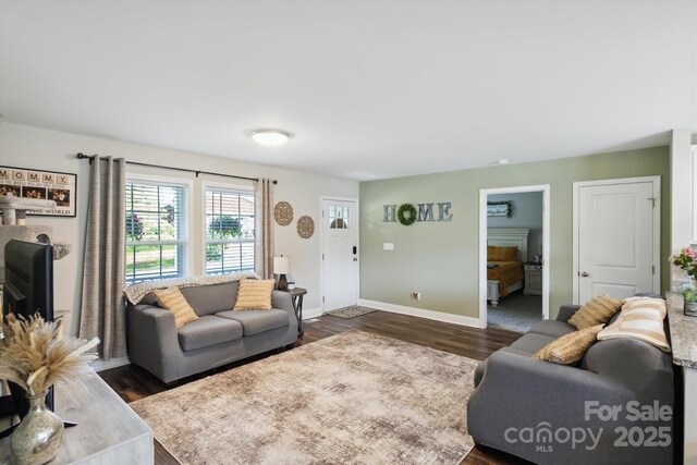 835 Jet St, Kannapolis, NC 28081 - living room featuring dark wood-type flooring and baseboards
