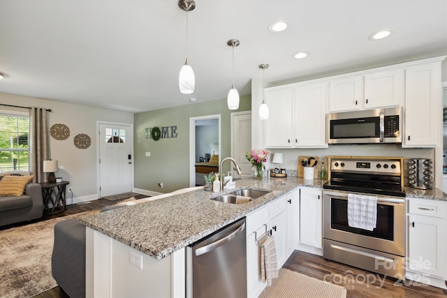 835 Jet St, Kannapolis, NC 28081 - kitchen featuring stainless steel appliances, a sink, a peninsula, white cabinetry, and recessed lighting