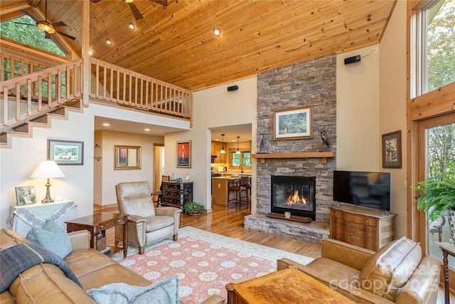 268 Trappers Run Dr, Burnsville, NC 28714 - living room with high vaulted ceiling, wooden ceiling, wood finished floors, a fireplace, and stairs