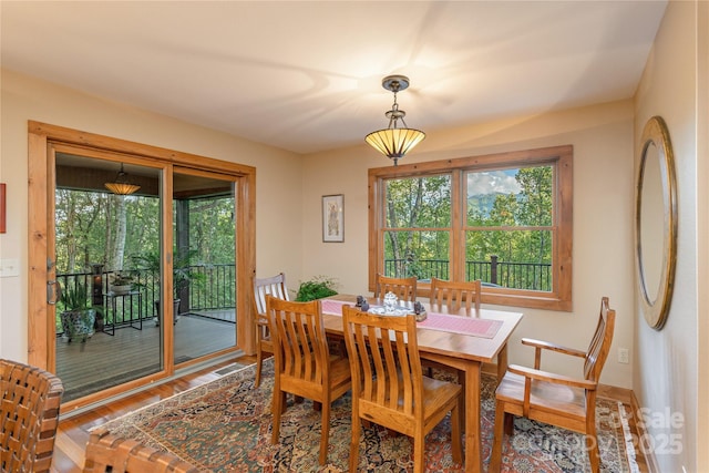 268 Trappers Run Dr, Burnsville, NC 28714 - dining space with plenty of natural light, wood finished floors, and baseboards