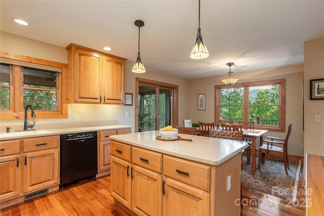 268 Trappers Run Dr, Burnsville, NC 28714 - kitchen with black dishwasher, a sink, light countertops, hanging light fixtures, and plenty of natural light