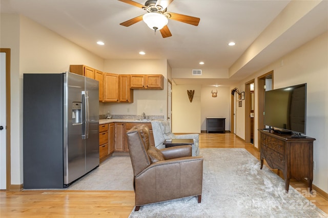 268 Trappers Run Dr, Burnsville, NC 28714 - kitchen with stainless steel refrigerator with ice dispenser, a sink, open floor plan, light wood finished floors, and ceiling fan