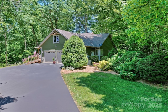 399 Stepping Stone Ln, Waynesville, NC 28786 - view of front of house featuring a garage and asphalt driveway